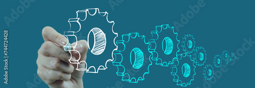 Transformational Leadership concept businesswoman hand drawing Cog gear icons on virtual sceen computer on blue background. photo