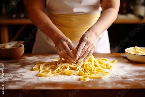 Yellow noodles made on wooden table with staple food ingredients