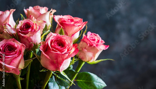 Closeup shot of a fresh roses bouquet on a dark background