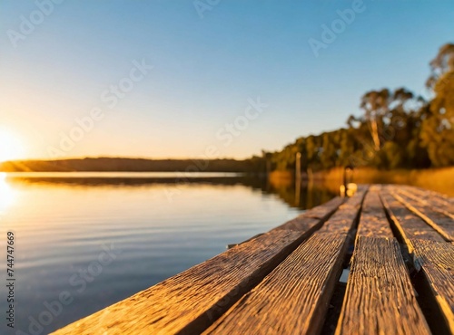 Wooden deck on the lake. Travel background with space for text design.