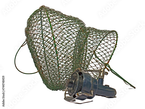 Vintage fishing trap with reel on white background