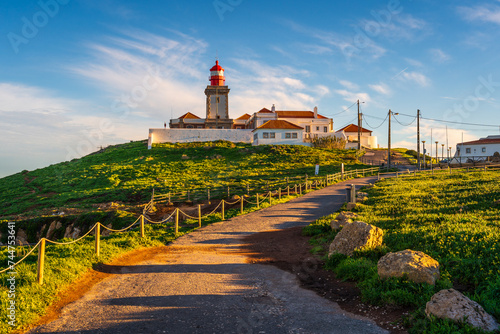 View of the Cabo da Roca lighthouse. Sintra, Portugal. Cape Cabo da Roca, the westernmost point of Europe. Beautiful sunny day at the coast near Lisbon
 photo