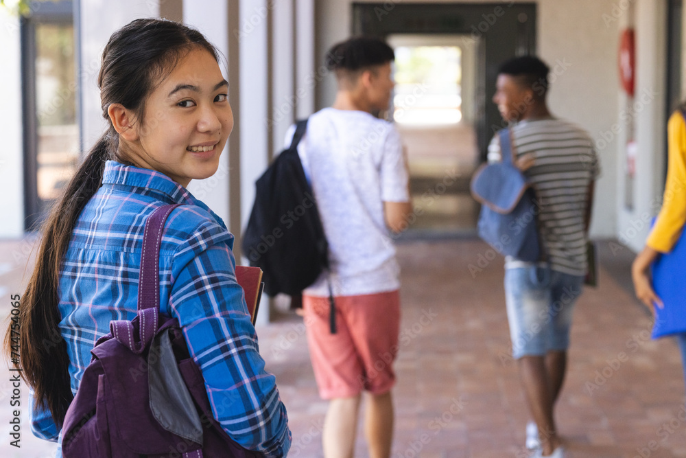 Teenage Asian girl and diverse friends at high school, with copy space Teenage Asian girl and diverse friends at high school, with copy space