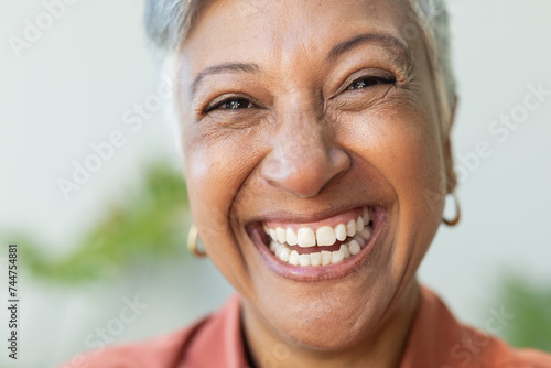 Close-up of a smiling biracial woman photo