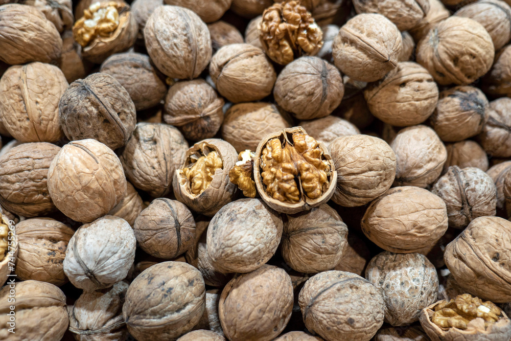 dried walnuts in shell for sale in the market, close-up shelled walnuts, dried walnuts in shell for sale in the market, close-up shelled walnuts,