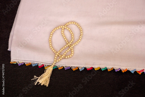hand-knitted patterned headscarf used during prayer and a rosary,
