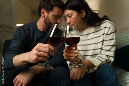 Boyfriend and girlfriend having a romantic date drinking wine