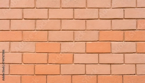 concrete block wall painted with light peach orange paint seamless pattern brickwall background