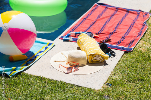 A colorful beach setup on the grass, with copy space photo