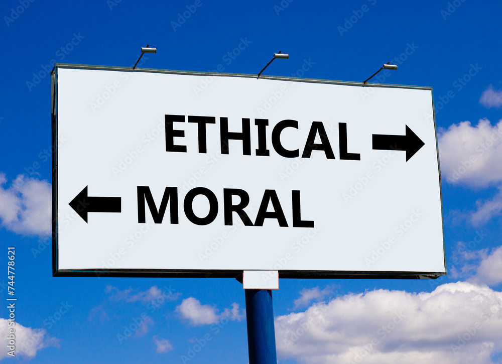 Ethical or moral symbol. Concept word Ethical or Moral on beautiful billboard with two arrows. Beautiful blue sky with clouds background. Business and ethical or moral concept. Copy space. Ethical or moral symbol. Concept word Ethical or Moral on beautiful billboard with two arrows. Beautiful blue sky with clouds background. Business and ethical or moral concept. Copy space.