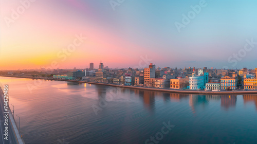 Panoramic view of the Havana skyline at sunset, pastel-colored buildings and the Malecón promenade, a timeless Cuban vista © Nii_Anna