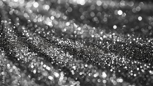 Abstract background of cascading silver glitter, flowing motion, symbolizing celebration, luxury, and festive moods