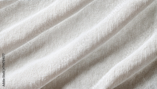  Close-up of a soft, textured, off-white fabric with a slightly wrinkled surface.