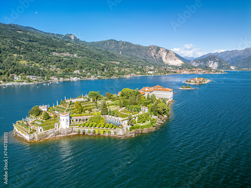 The drone aerial view of Borromean islands on Maggiore Lake and Stresa town, Italy. The Borromean Islands are a group of three small islands and Isola Bella.