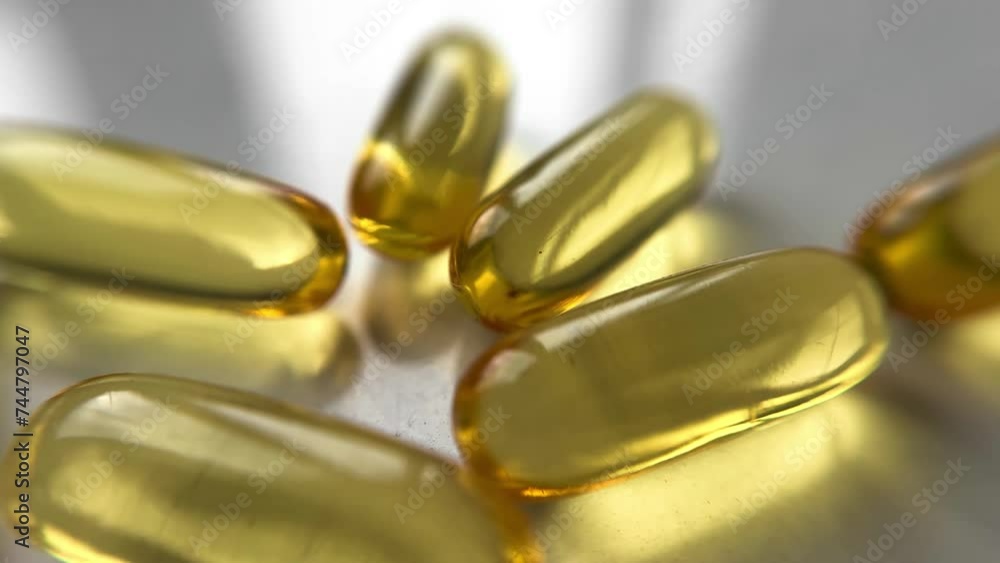 omega 3 capsules on a white background with white light near the window. omega 3 capsules on a white background with white light near the window.