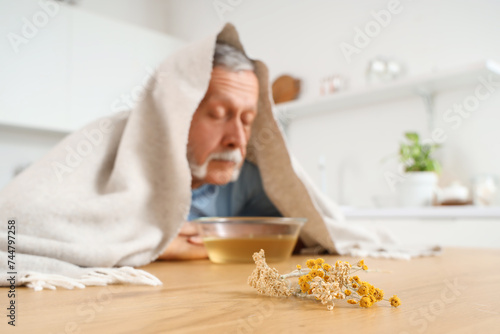 Mature man with towel doing...