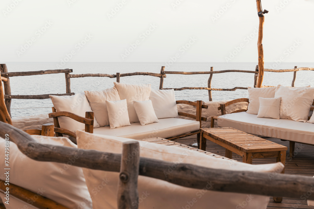 Reserved VIP area with white sofas on the terrace of a luxury hotel ...