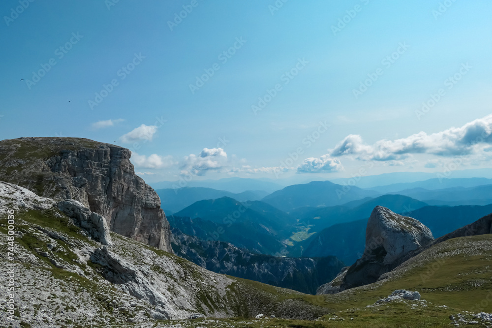 Panoramic view of majestic mount peaks of Hochschwab massif, Styria, Austria. Idyllic hiking trail on high altitude alpine meadow, remote Austrian Alps in summer. Mount Grosser Beilstein, Stangenwand
