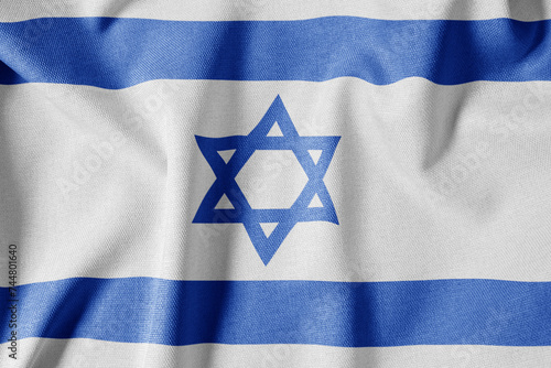 National Flag on Textured Fabric Background. Silk textured flag, realistic wave and flag look. IL Flag of Israel