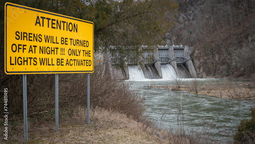 Warning sign in front of Fort Patrick Henry Dam, located in Sullivan County in Kingsport, Tennessee on the South Fork Holston River. photo