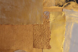 Gold, bronze paper collage paper frame painting wall. Abstract glow texture copy space relief background.