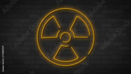 Neon radiation, radioactive neon sign on dark brick wall. Nuclear warning. Radioactive danger trippy yellow triangle. Motion animation. Video available in 4K render footage.