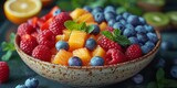 An assorted gourmet fruit bowl featuring fresh berries, vibrant raspberries, and delicious orange cube.