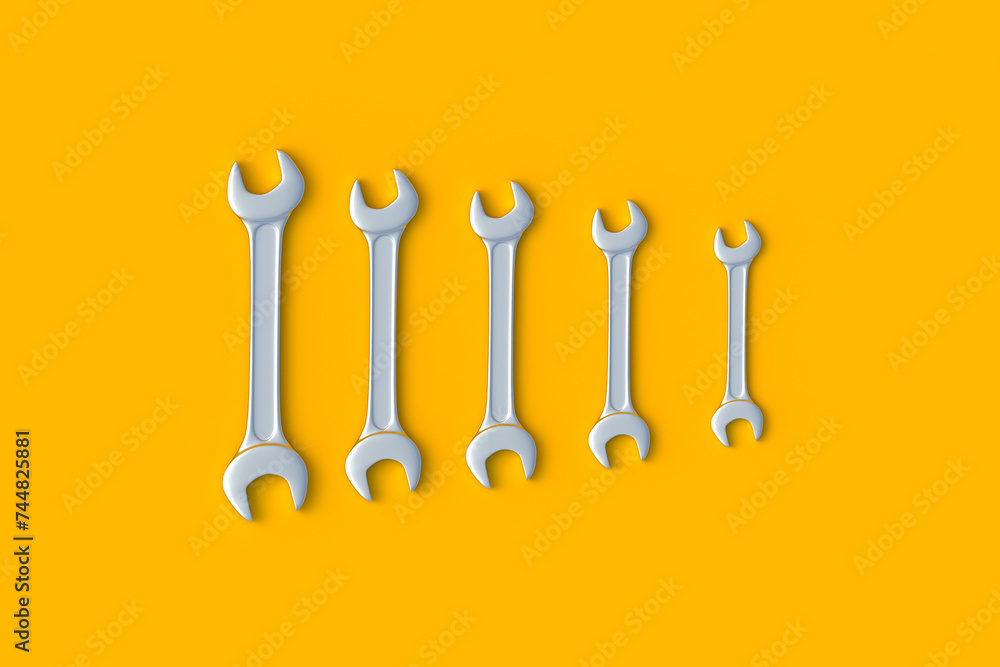 Row of wrenches of different sizes on orange background. Metal spanner in workshop. Repair and maintenance tool. 3d render Row of wrenches of different sizes on orange background. Metal spanner in workshop. Repair and maintenance tool. 3d render