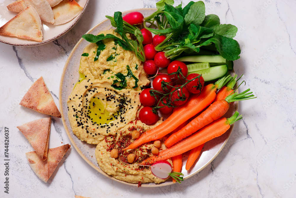 Hummus with fresh crispy vegetables. top view . Hummus with fresh crispy vegetables. top view .