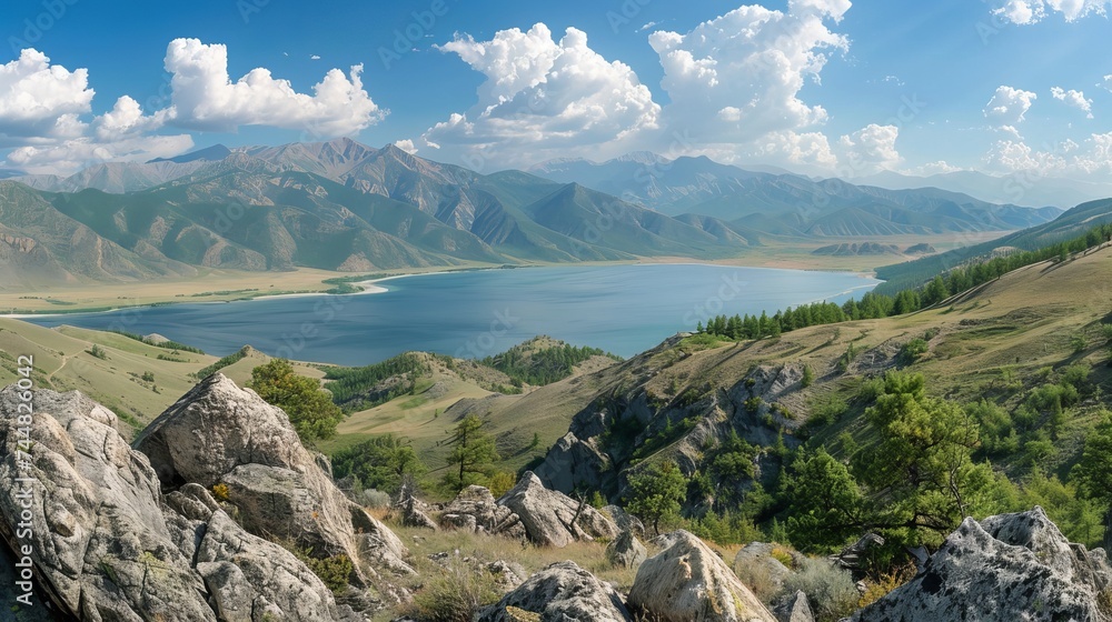 The Altai mountain landscape unfolds in a vast panorama, featuring a serene lake nestled amidst towering mountain ranges. This majestic scene captivates with its pristine beauty and rugged wilderness