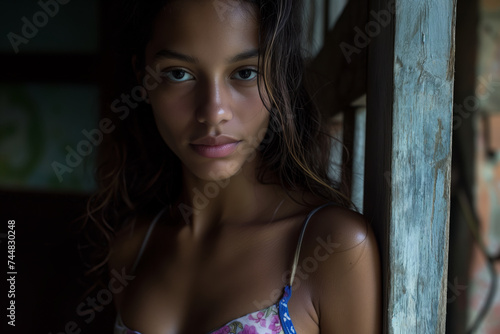 Young Brazilian Woman from Sao Paulo posing in Bikini: Portrait of a beautiful young brazilian woman in bikini looking at camera.