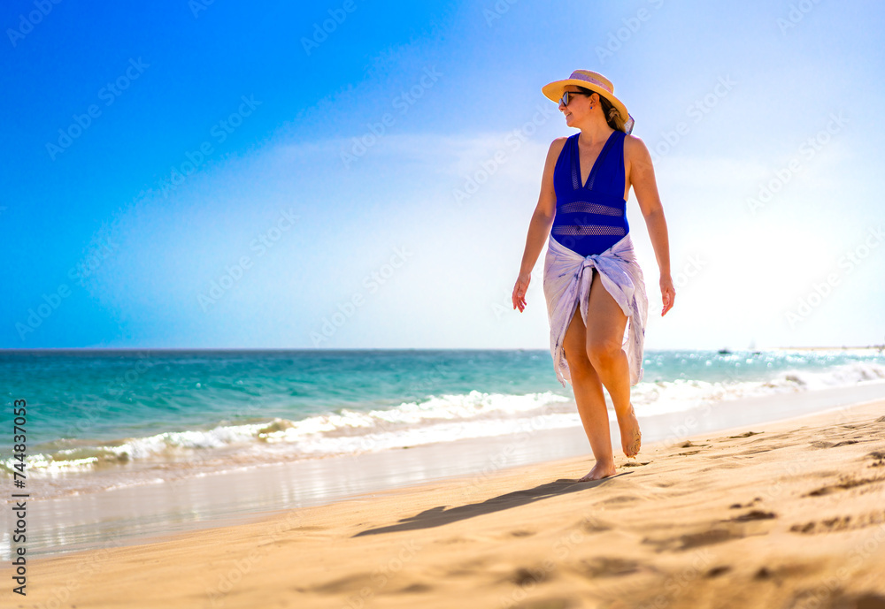 Beautiful woman walking on sunny beach Santa Maria, Sal Island, Cape Verde
Beautiful woman walking on sunny beach Santa Maria, Sal Island, Cape Verde