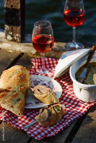 Picnic on the river with liver pate and wine