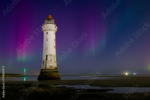 The Northern Lights visible over the River Mersey and New Brighton Lighthouse