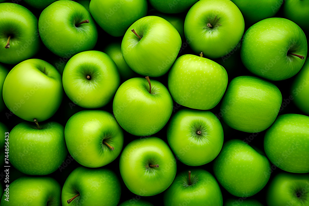 A full frame of vibrant green apples neatly arranged. A full frame of vibrant green apples neatly arranged.