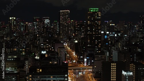 Wallpaper Mural Aerial slide and pan footage of group of tall modern apartment buildings in metropolis. Illuminated wide street in urban borough. Osaka, Japan Torontodigital.ca