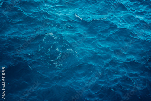 Calm blue ocean surface with gentle waves  depicting serenity and depth.