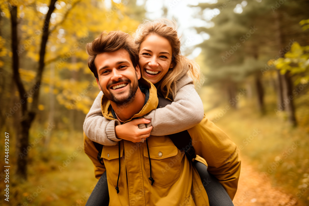 A happy couple enjoys a piggyback ride in an autumn forest, sharing a moment of joy and togetherness amidst vibrant fallen leaves.
A happy couple enjoys a piggyback ride in an autumn forest, sharing a moment of joy and togetherness amidst vibrant fallen leaves.