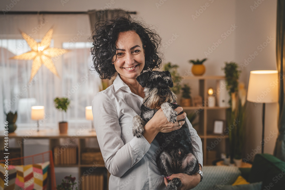 portrait of adult caucasian woman mature female with pet dog at home portrait of adult caucasian woman mature female with pet dog at home