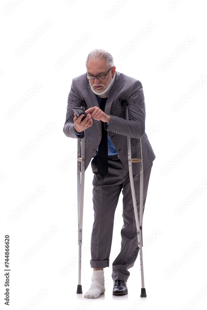 Old businessman after car accident isolated on white Old businessman after car accident isolated on white
