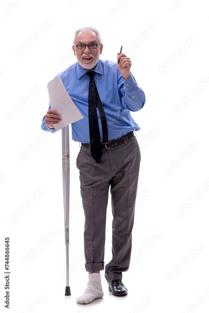 Old businessman with crutches isolated on white Old businessman with crutches isolated on white