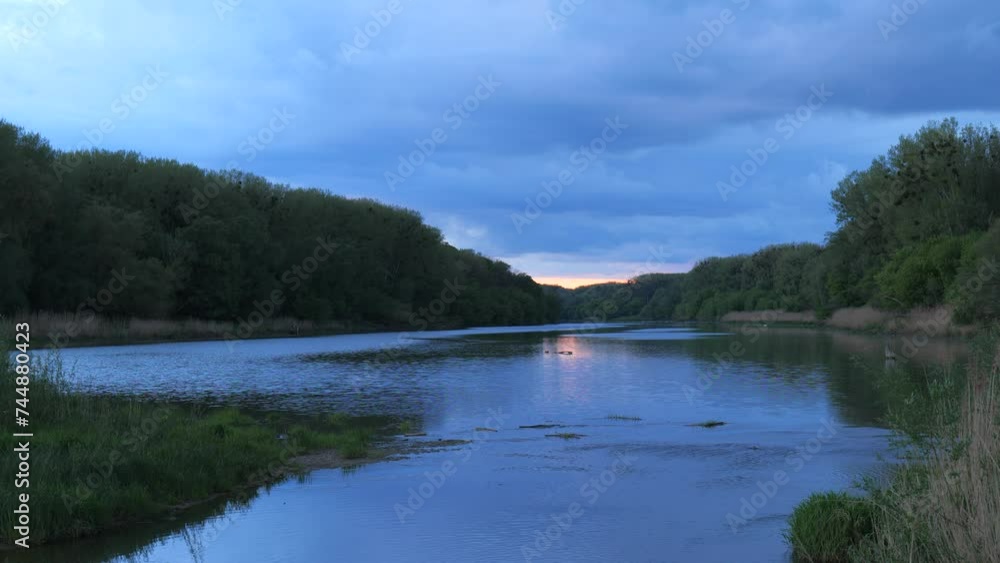River Flowing after Sunset with Pink Horizon
