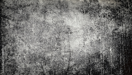 Old washed grunge mottled texture. High-contrast mottled and scratched background. Dirty backdrop with black scuffed edges and old faded antique design.