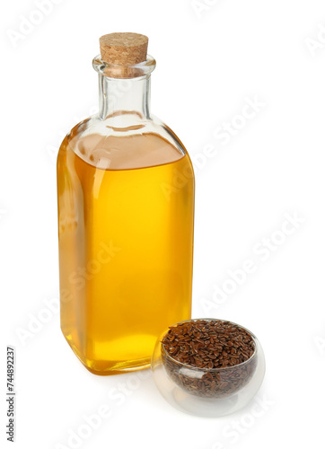 Vegetable fats. Flax oil in glass bottle and seeds isolated on white
