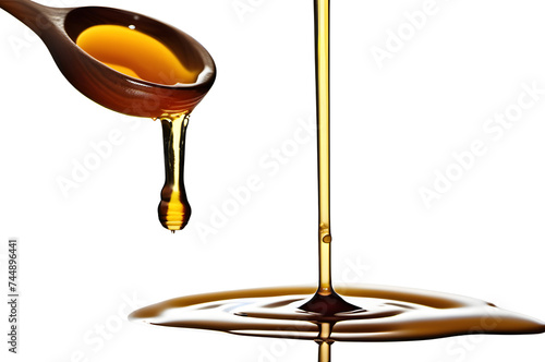 Honey dripping from spoon on a transparent background