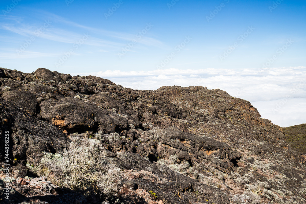 Above the Clouds: Rugged Terrain Meets Endless Sky