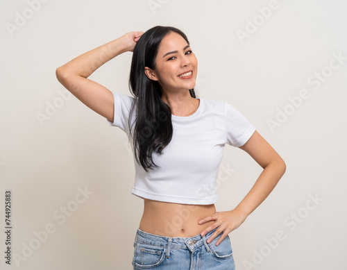 Beautiful smiling happy young asian woman age around 25. Charming female lady standing pose on isolated white background. Asian attractive woman people confident on backdrop.