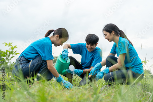 Volunteering Protection of environment and nature ecology concept. Group of volunteer plant a tree Plant trees water them till the soil. Nature for sustainable environment.Global warming concept. © Chanakon
