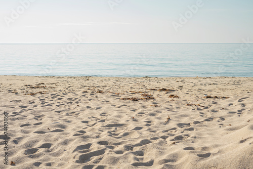Seascape. Blue sea and white sand. Calm and relaxation background.