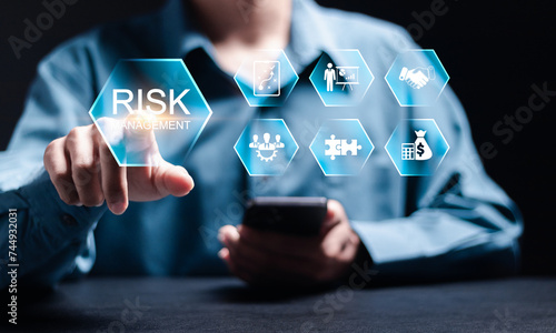 Risk management concept. Risk control and management strategies for risky businesses. Businessman use smartphone with Risk analysis in business decisions.